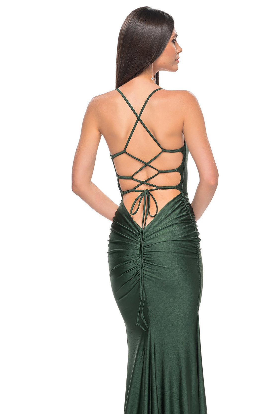 La Femme 31618 Chic Fitted Long Jersey Prom Dress - A sophisticated prom dress with a chic fitted silhouette, ruching detail, criss-cross style bodice, and an open back with a lace-up tie. Model is wearing the dress in the color emerald.