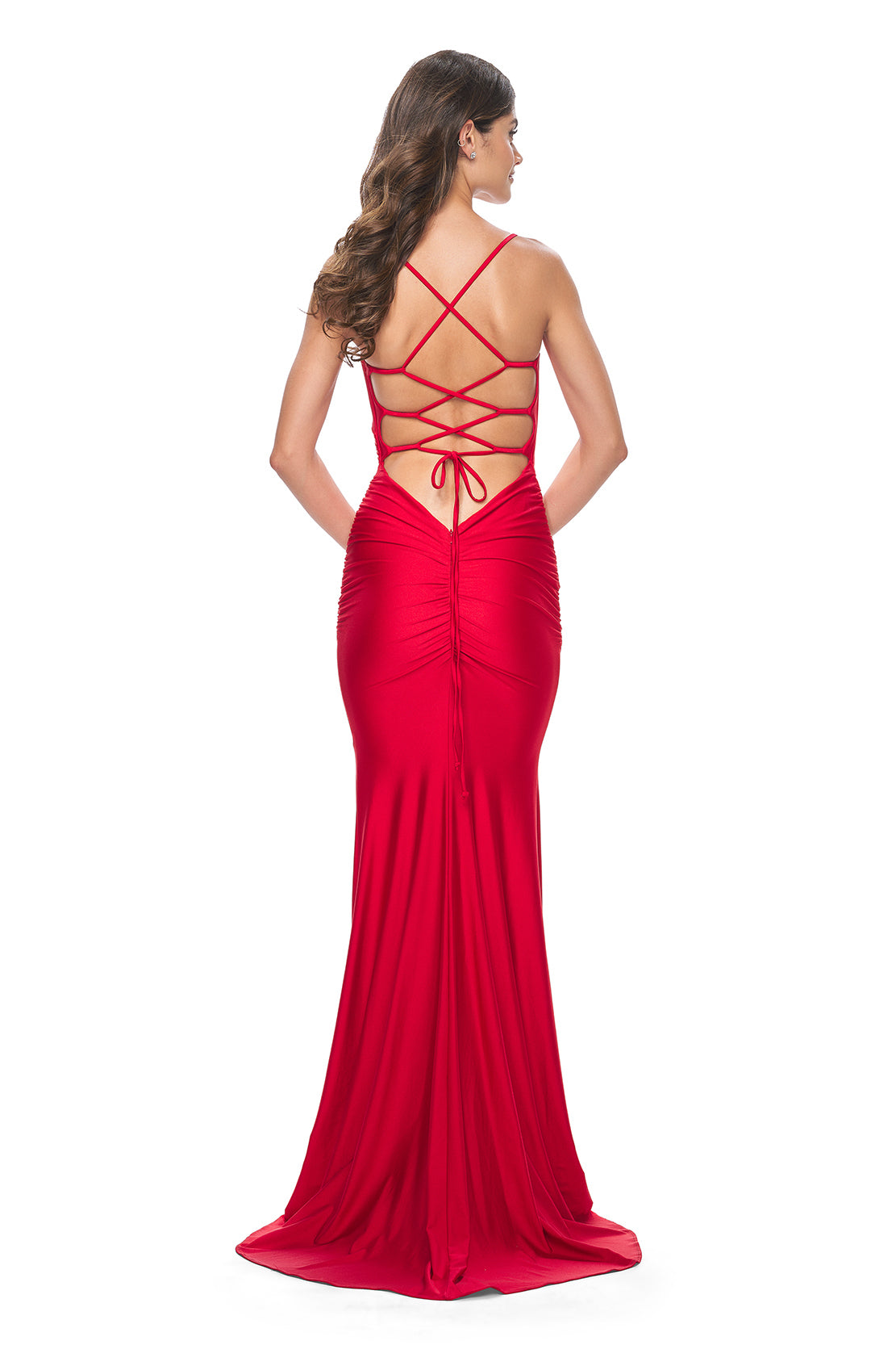 La Femme 31618 Chic Fitted Long Jersey Prom Dress - A sophisticated prom dress with a chic fitted silhouette, ruching detail, criss-cross style bodice, and an open back with a lace-up tie. Model is wearing the dress in the color red.