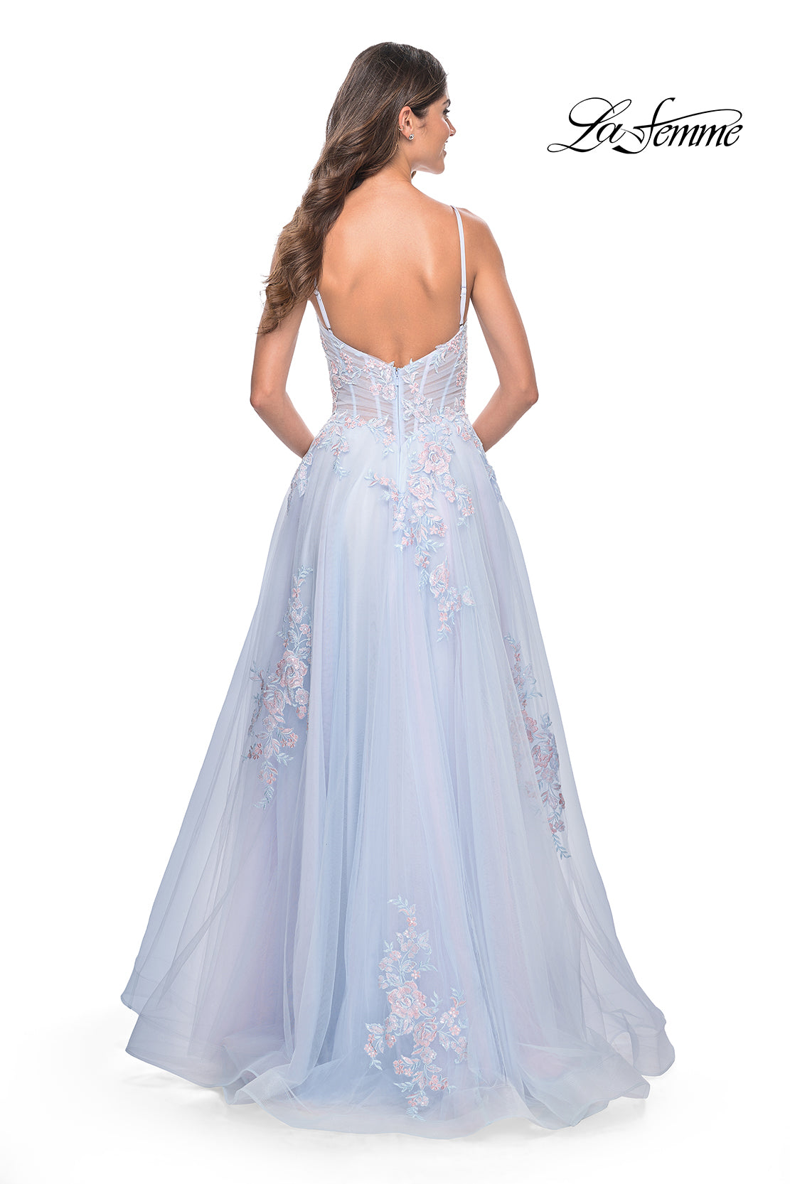 La Femme 31939 Scattered Lace Applique A-Line Prom Gown - An enchanting A-line gown featuring two-color scattered lace applique on tulle, with an illusion waist and boning detail for a magical and captivating prom look.  Model is wearing the dress in the color light blue.