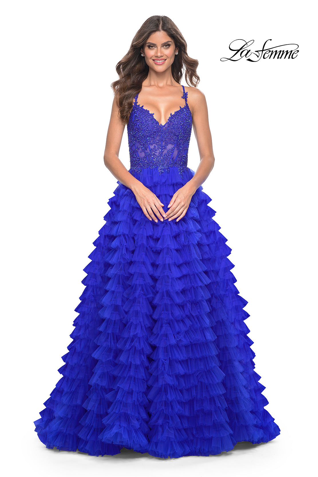 La Femme 32128 Dreamy Ruffle Tulle Tiered Prom Dress - A captivating prom dress featuring a dreamy ruffle tulle tiered skirt, high slit, and intricate lace applique details for an enchanting and sophisticated look.  The model is wearing royal blue.