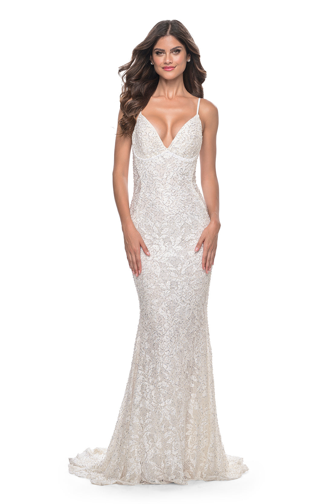 La Femme 32309 Beaded Lace Mermaid Prom Gown - An enchanting prom gown with a beaded lace mermaid silhouette, open lace-up back, and sheer lace panels on both sides.  The model is wearing the dress in the color white.