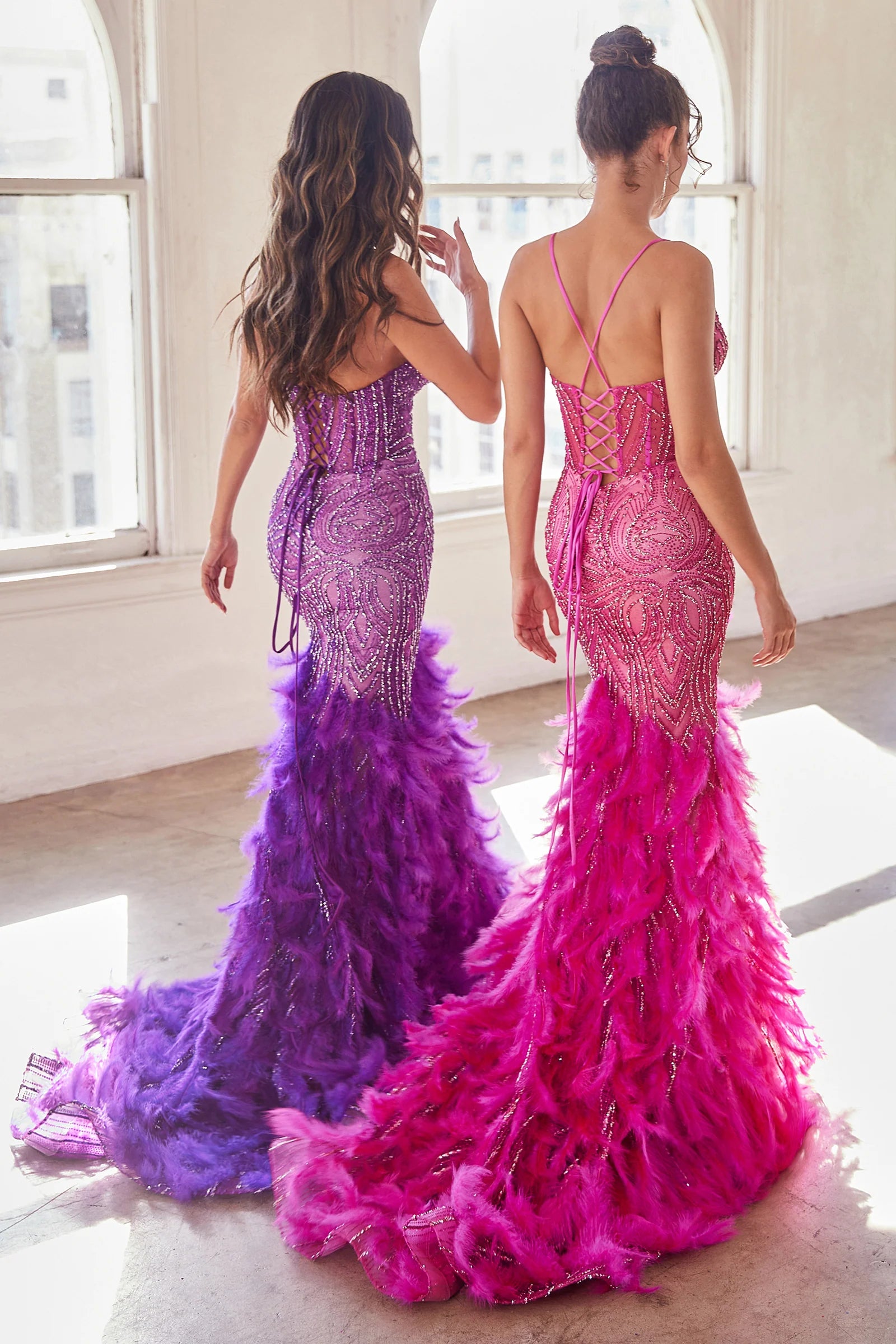 LaDivine CC2308 Enchanting Mermaid Prom Dress - A captivating mermaid silhouette dress with thin straps, v-neckline, glitter and bead embellishments on the sheer boned bodice, a tiered feathered skirt, and an open lace-up corset back. Picture is the back view of Nova Purple and Azalea Pink.