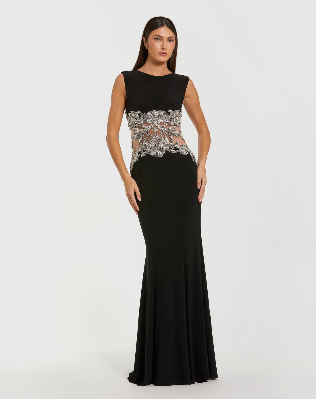 Model wearing Mac Duggal 2324 sleeveless jersey gown with beaded illusion waist detail.