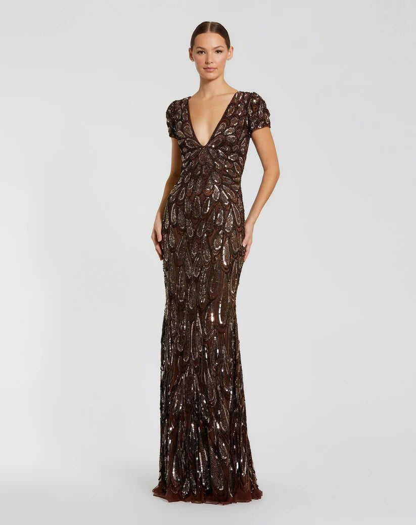 Model wearing Mac Duggal 5243 evening gown with deep V-neckline, cap sleeves, and hand-beaded sequin teardrop pattern.