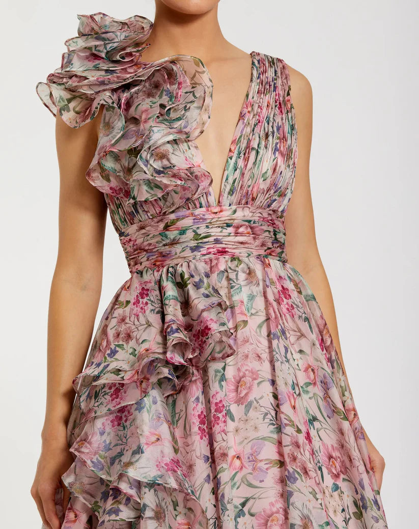 Model wearing Mac Duggal 68947 floral chiffon ballgown with plunging V-neckline, ruffle shoulder detail, and voluminous A-line skirt.  Model is wearing the dress in pinkMulti.  Close Up view.