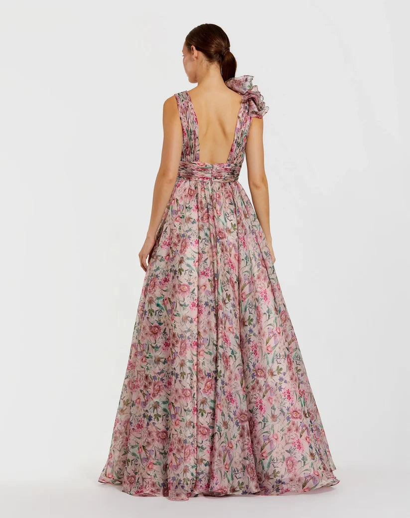 Model wearing Mac Duggal 68947 floral chiffon ballgown with plunging V-neckline, ruffle shoulder detail, and voluminous A-line skirt.  Model is wearing the dress in pinkMulti.  Back view.