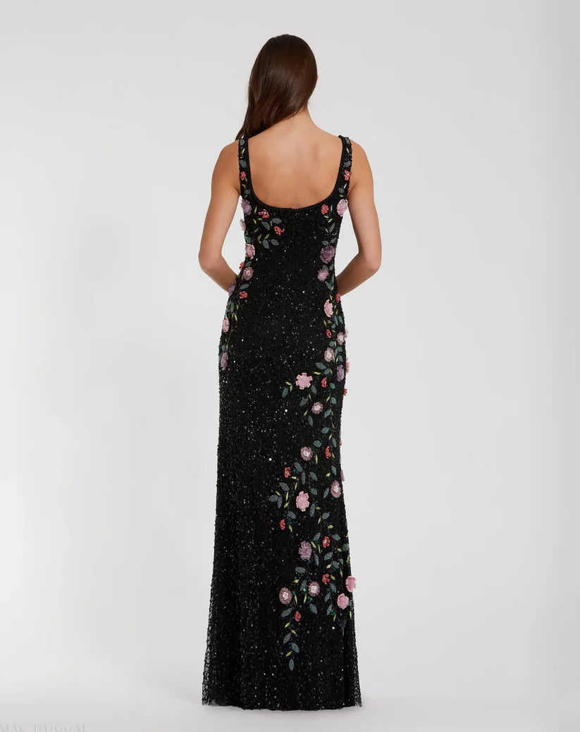 Black evening gown with floral embroidery on a white background