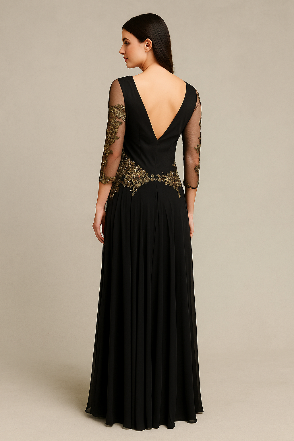 Model wearing Mandalay C801429DEBL long sleeve embroidered evening gown with plunging neckline and flowing skirt.  Back View of the dress.