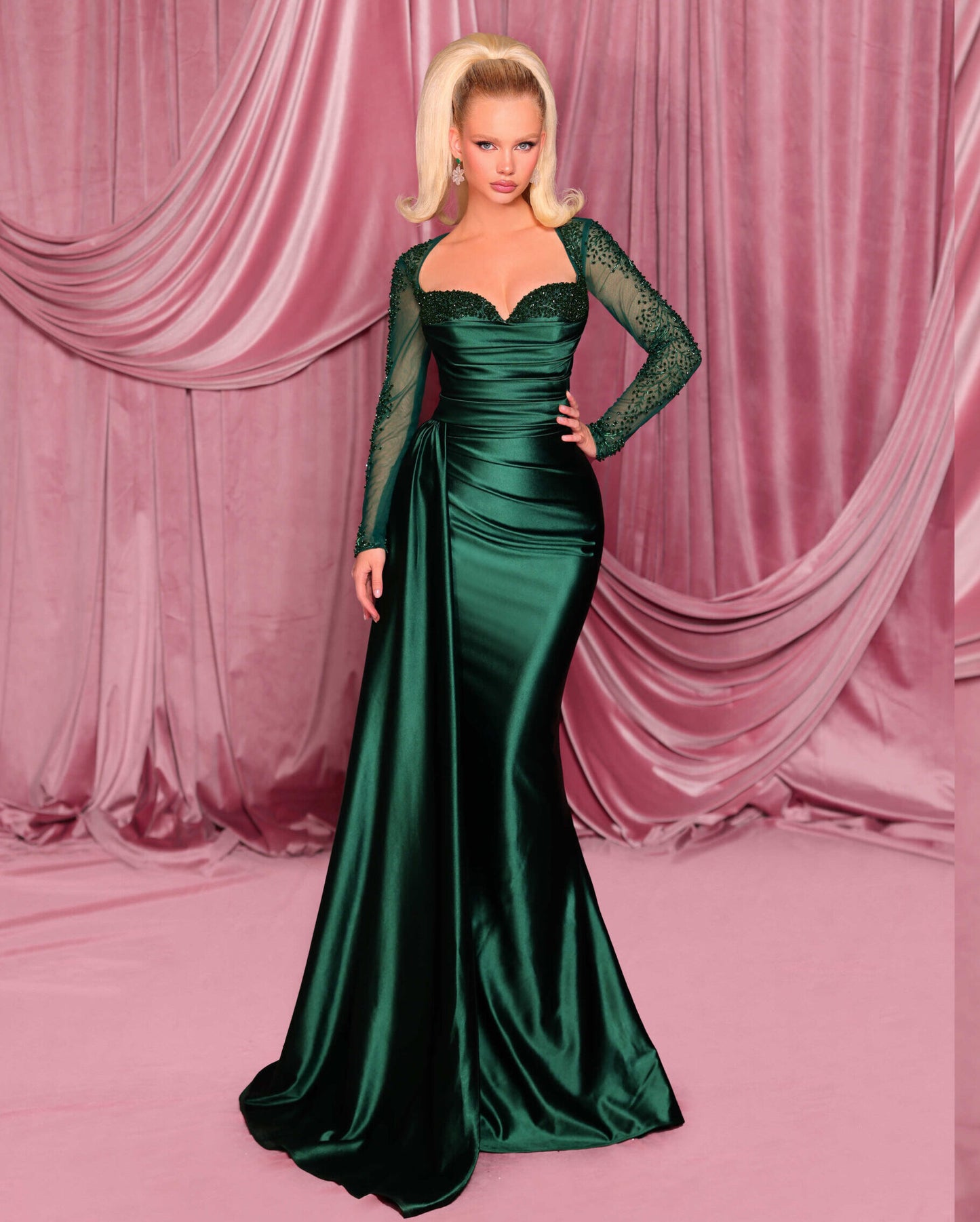 Shop Nicoletta NC3078 long sleeve embellished evening gown with sweetheart bodice and draped waist. Perfect for formal evening occasions.  Model is wearing the color deep emerald.  Front View.