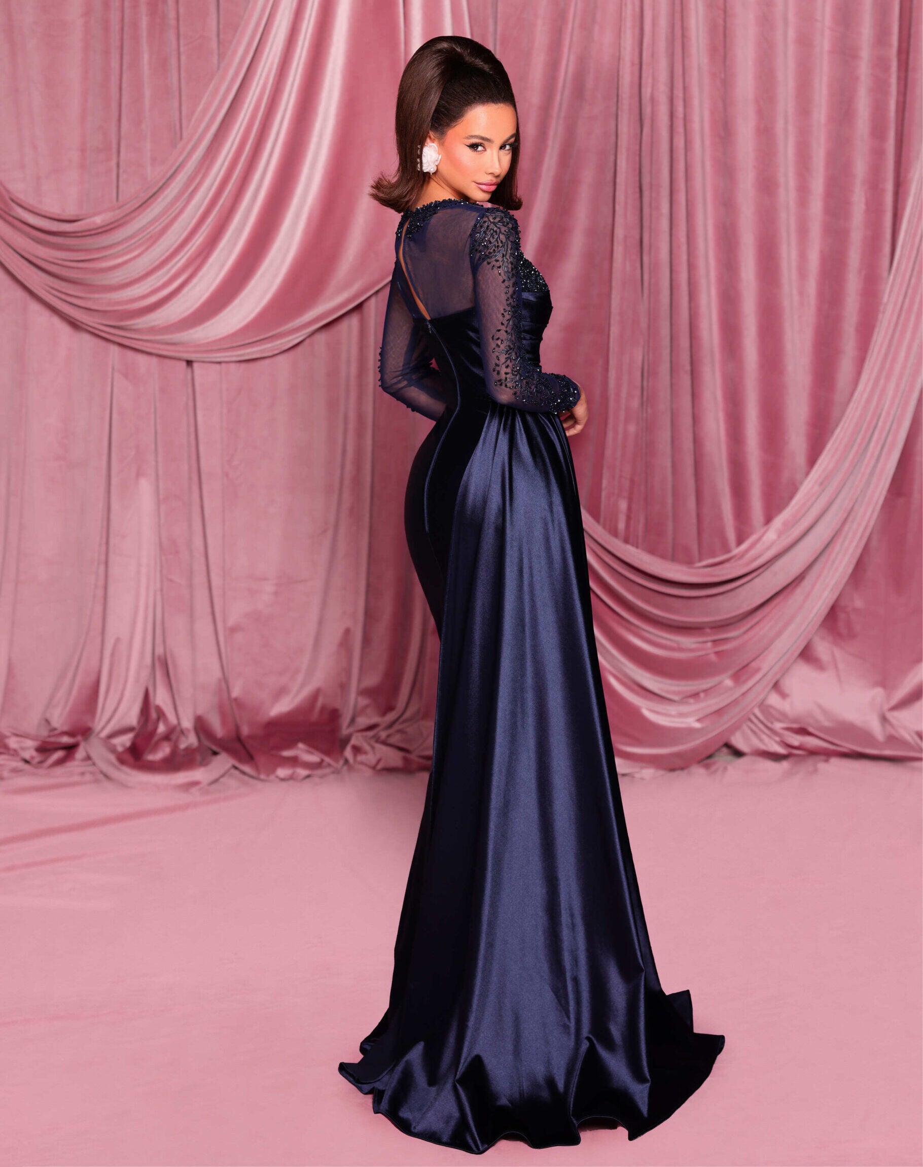 Shop Nicoletta NC3078 long sleeve embellished evening gown with sweetheart bodice and draped waist. Perfect for formal evening occasions.  Model is wearing the color Midnight.  Back View.