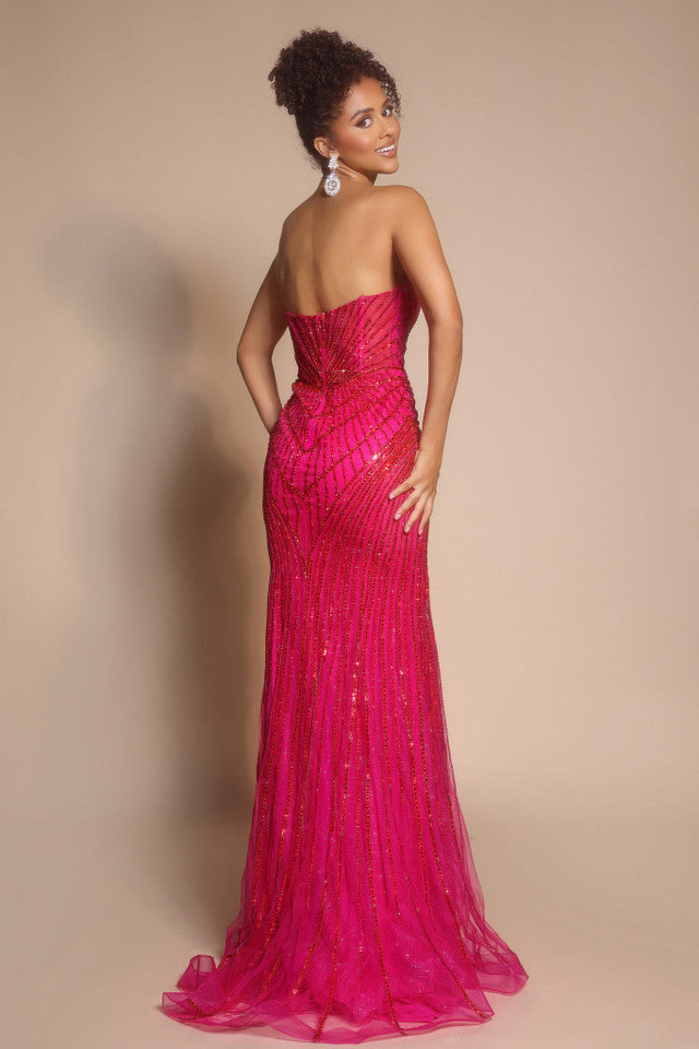 Model wearing Portia & Scarlett PS26004 strapless beaded mermaid gown with sweetheart neckline and intricate linear detailing.  Model is wearing the color fuchsia.
