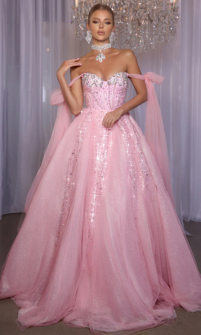 Model wearing Portia & Scarlett PS26030 off-the-shoulder ball gown with embellished corset and full skirt.