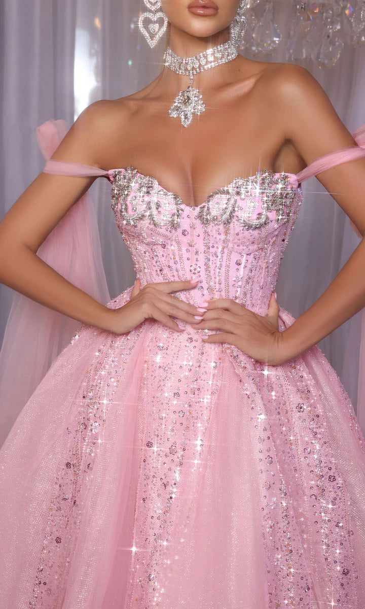 Model wearing Portia & Scarlett PS26030 off-the-shoulder ball gown with embellished corset and full skirt.
