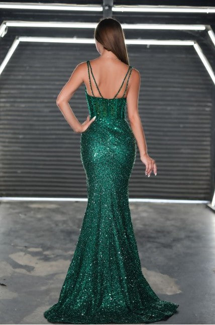 Portia & Scarlett PS24943 - A prom gown with beaded straps, draped skirt, and a high slit for an alluring and captivating look. The model is wearing the dress in the color emerald.
