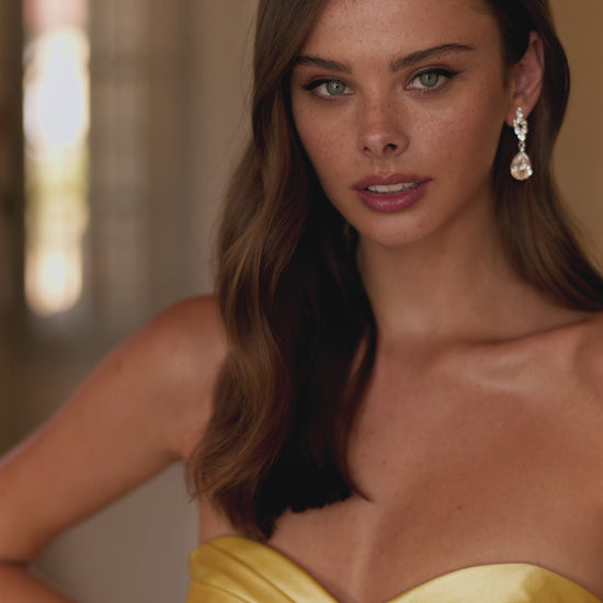 This is a video of the model wearing Sherri Hill style 57562 in the color yellow.