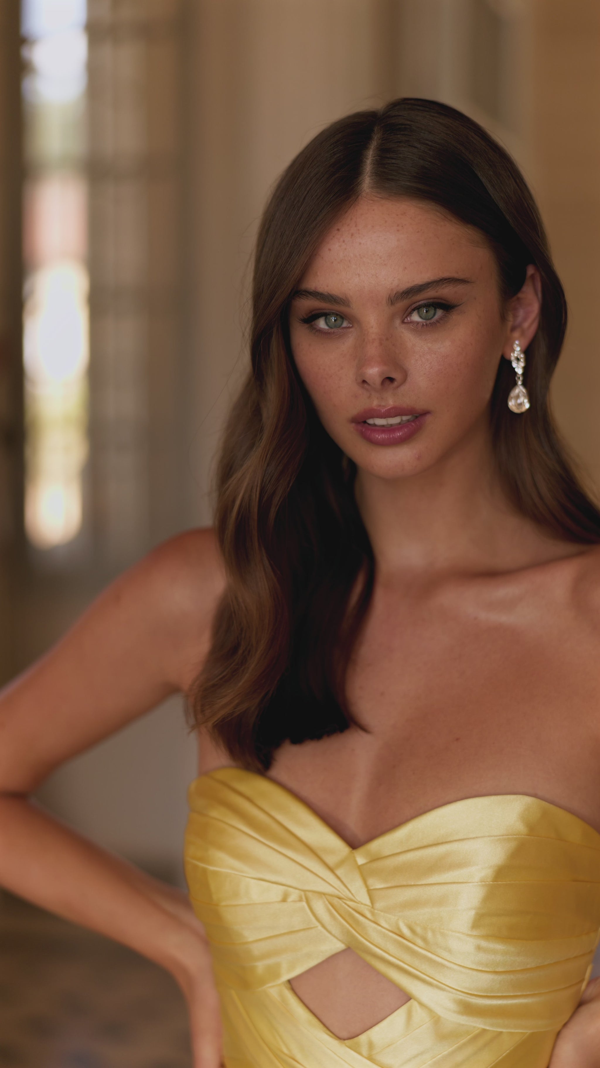 This is a video of the model wearing Sherri Hill style 57562 in the color yellow.