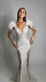 Portia & Scarlett PS1986 - An exquisite lace and feather detail evening gown, perfect for glamorous evenings and red carpet events.  This is a video of the model wearing the dress.
