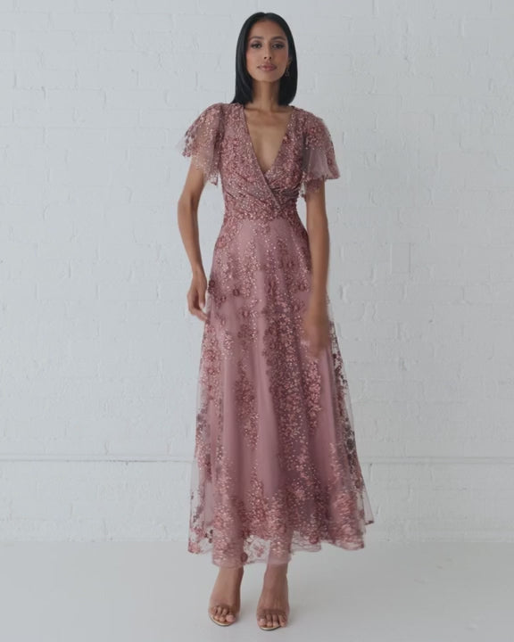 Model wearing Mac Duggal 20486 gown with faux wrap v-neckline, flutter sleeves, and rhinestone floral embellishments.  This is a video.