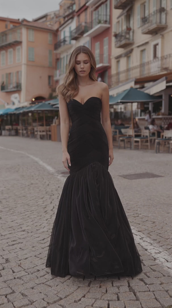 Sherri Hill 57074 strapless mermaid metallic mesh gown with a skirt slit in black, perfect for formal evenings or prom.