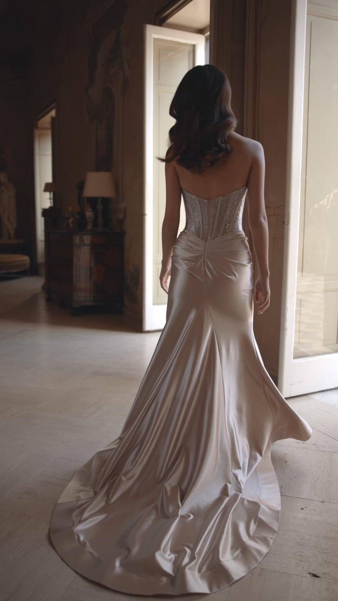 Model wearing Sherri Hill 57473 strapless fitted gown with sparkling hot fix corset and high-slit skirt.  This is a video.