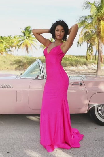 A fitted rhinestone jersey gown with a V-neckline and lace-up open back. Perfect for prom and formal events.  This is a video.