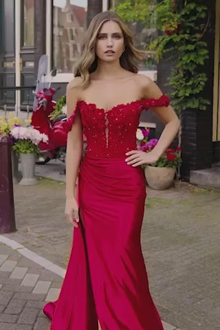 Sherri Hill 56176 Ruched Waist Prom Gown with High Slit - An enchanting prom gown featuring a ruched waist, high slit, boned floral bodice, keyhole bodice, and off-the-shoulder cap sleeves for a flattering and stylish look.  This is a video of the model wearing the gown in red.