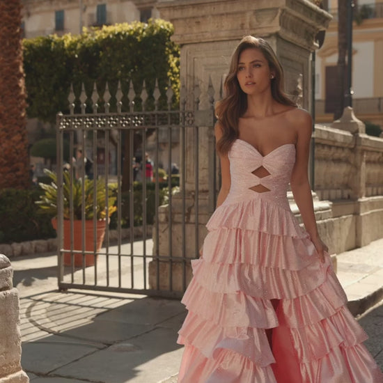 Model wearing Sherri Hill 57416 strapless ruffle gown with keyhole bodice, slit skirt, and lace-up back design.  This is a video of the model wearing the dress.