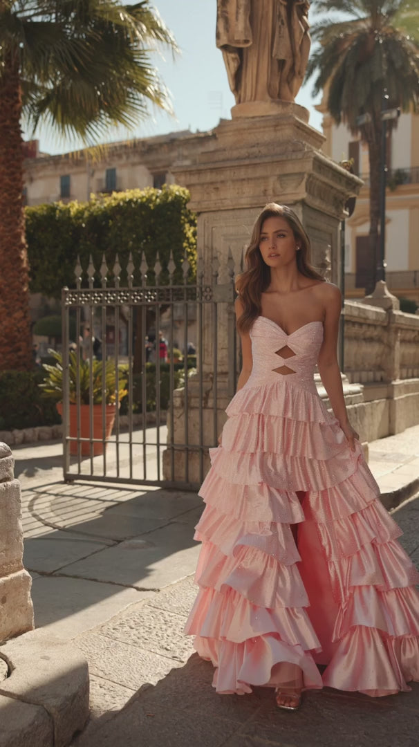 Model wearing Sherri Hill 57416 strapless ruffle gown with keyhole bodice, slit skirt, and lace-up back design.  This is a video of the model wearing the dress.