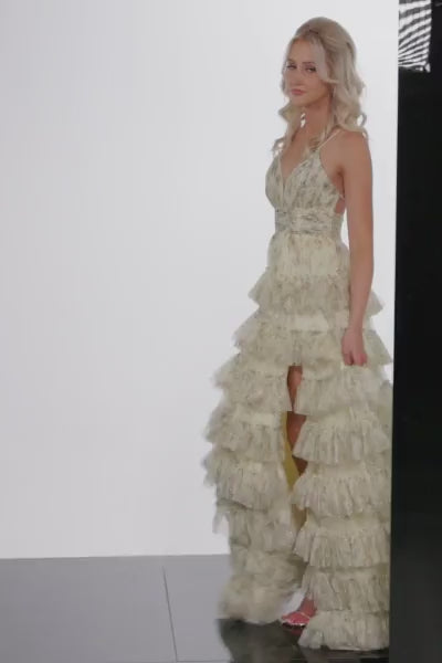The Jovani Floral Print A-line Gown, a captivating ensemble with a pleated bodice, V-neckline, and a playful ruffle skirt, perfect for proms and formal occasions. This a video of the dress.