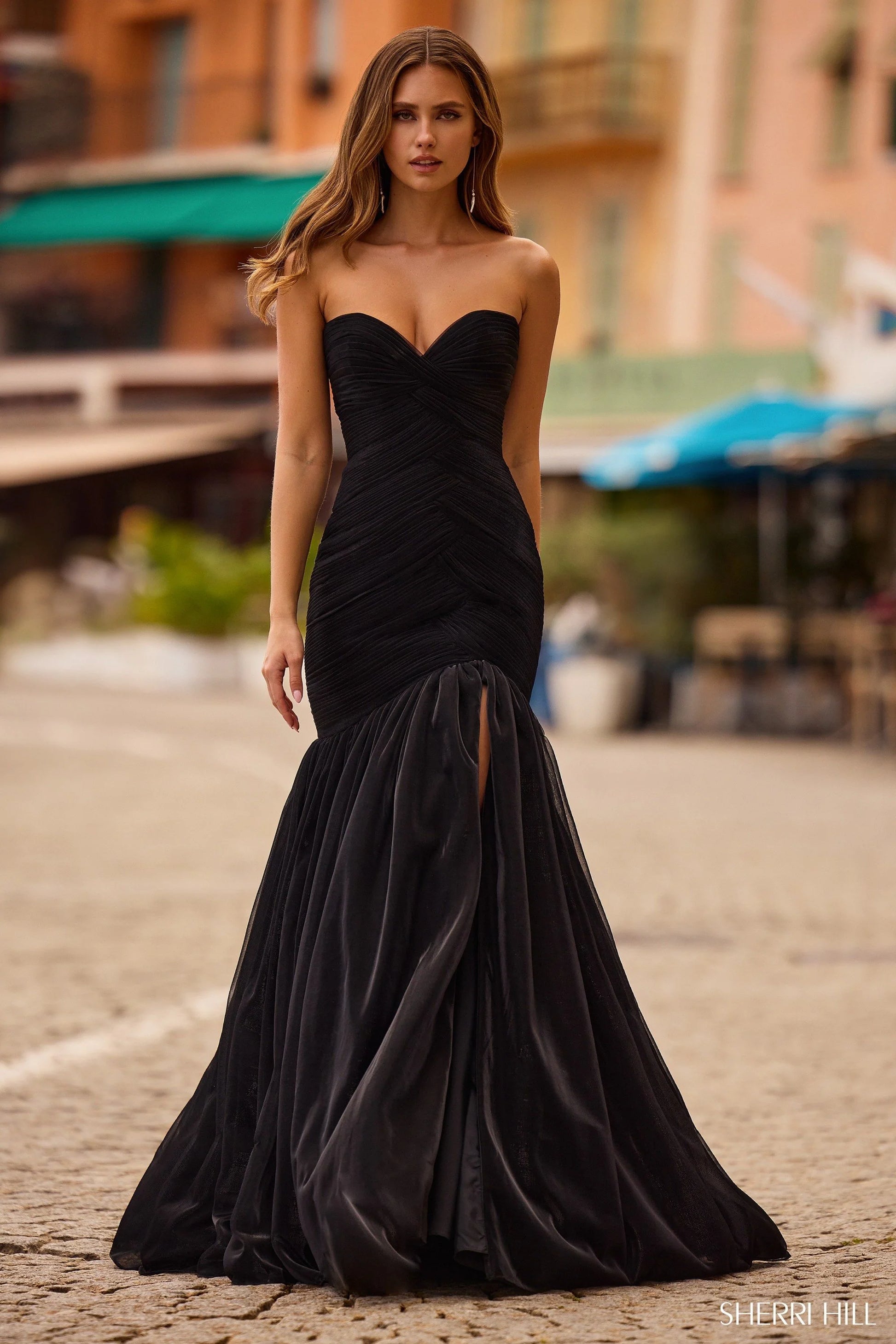Sherri Hill 57074 strapless mermaid metallic mesh gown with a skirt slit in black, perfect for formal evenings or prom.