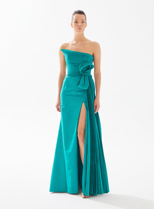 Stunning strapless draped dress with side pleat and bow by Tarik Ediz, available at Madeline's Boutique in Toronto and Boca Raton