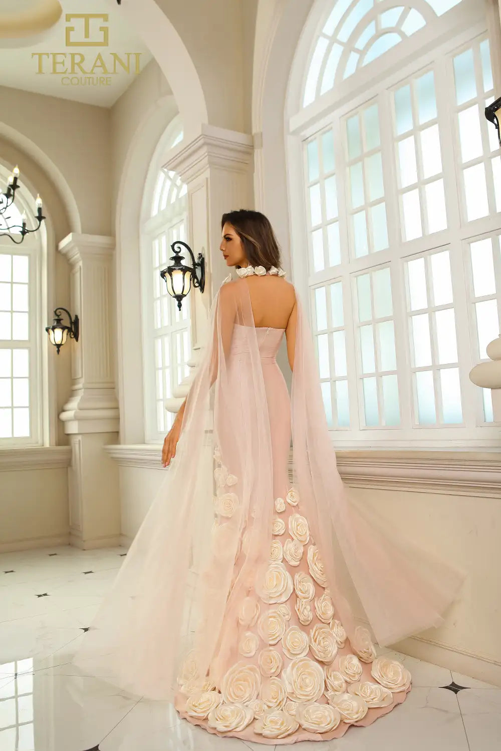 Terani Couture 251GL4184 Stretch Mikado Trumpet Gown with 3D floral appliqués, strapless bodice, and detachable sheer cape.