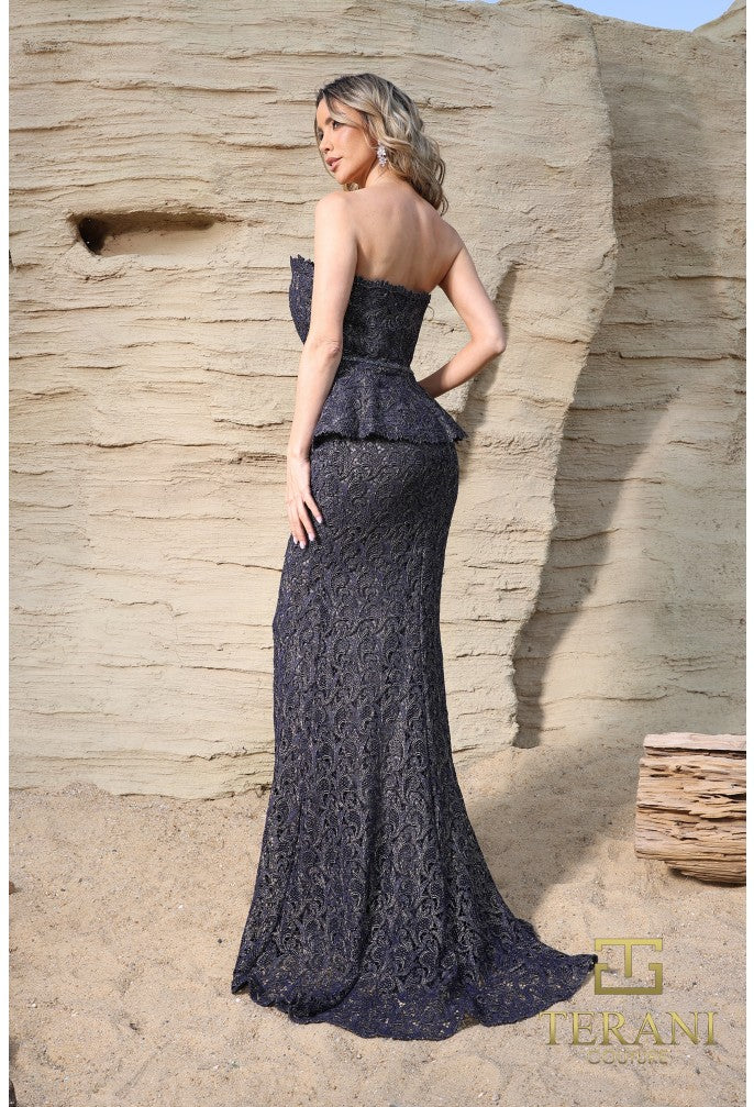 Model wearing Terani Couture 252E5144 strapless lace gown with peplum waist and fit and flare silhouette.