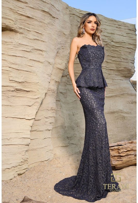 Model wearing Terani Couture 252E5144 strapless lace gown with peplum waist and fit and flare silhouette.