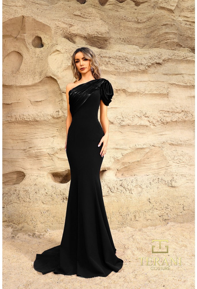 Model wearing Terani Couture 252E5514 one-shoulder gown with puff sleeve, draped bodice, and chapel train in the color black.  Front View.