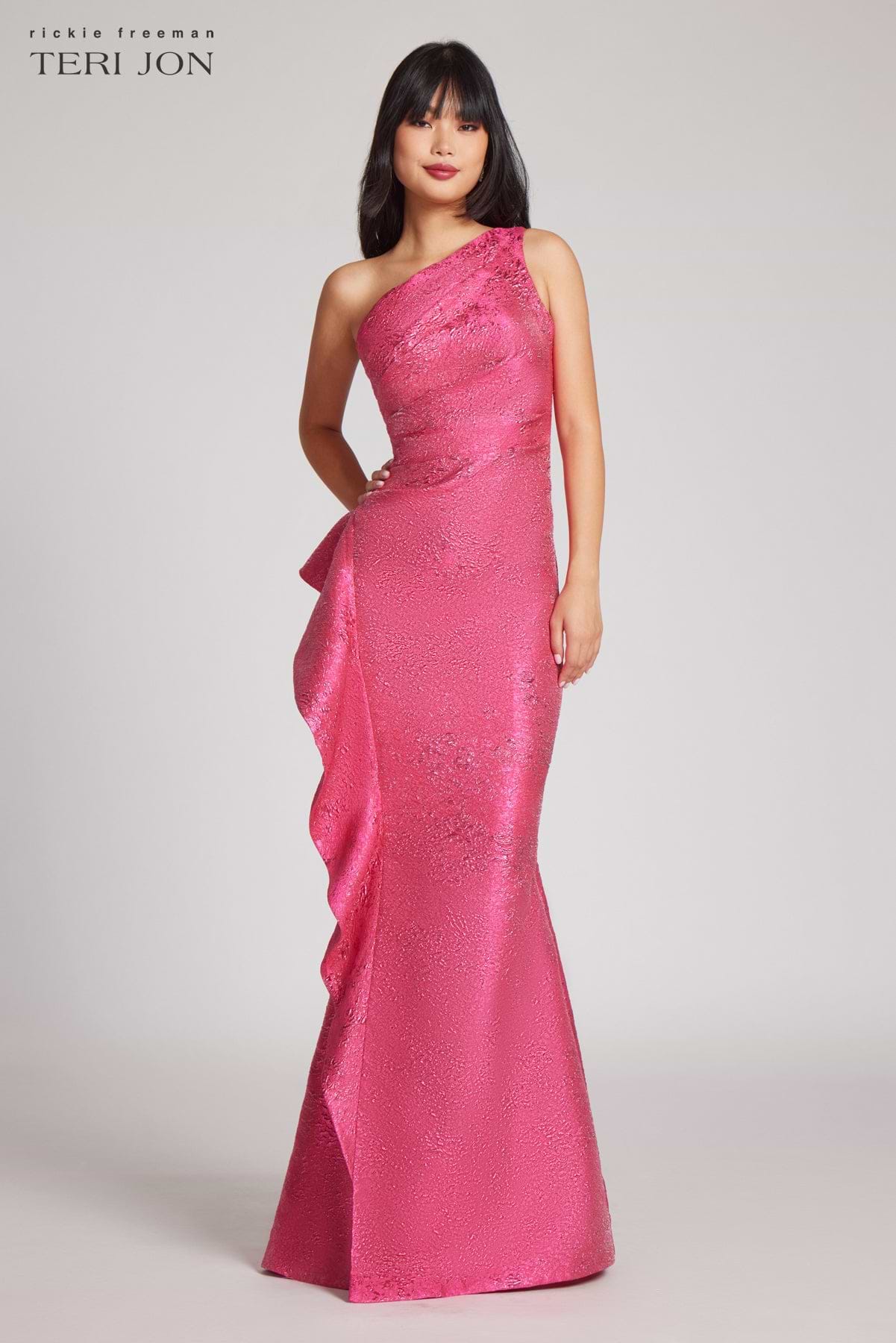 Model wearing Teri Jon 246024 jacquard gown featuring a one-shoulder design, ruching, and a dramatic side ruffle, perfect for formal occasions.